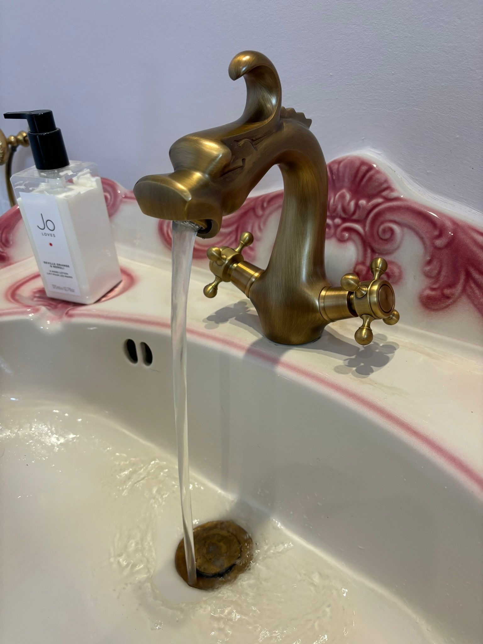 Brass tap with running water