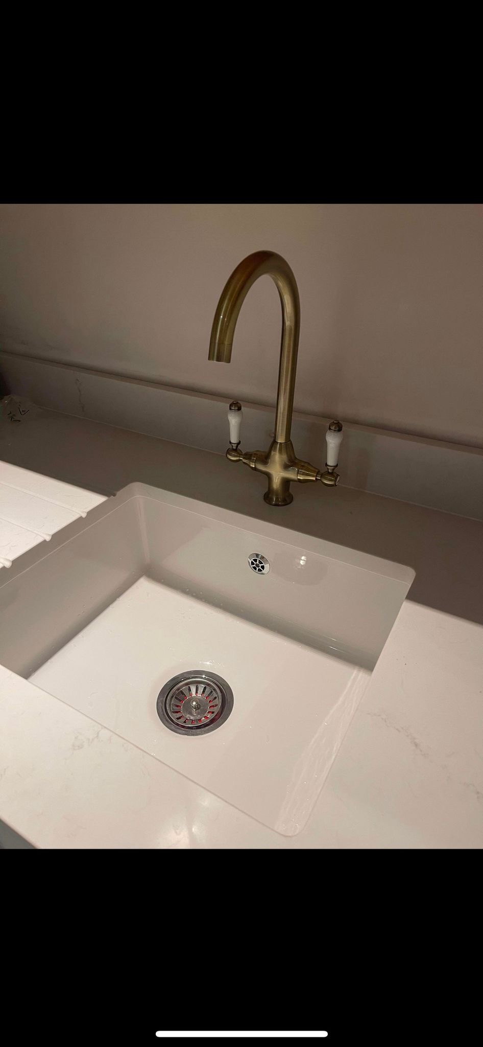 Kitchen sink with brass tap installation