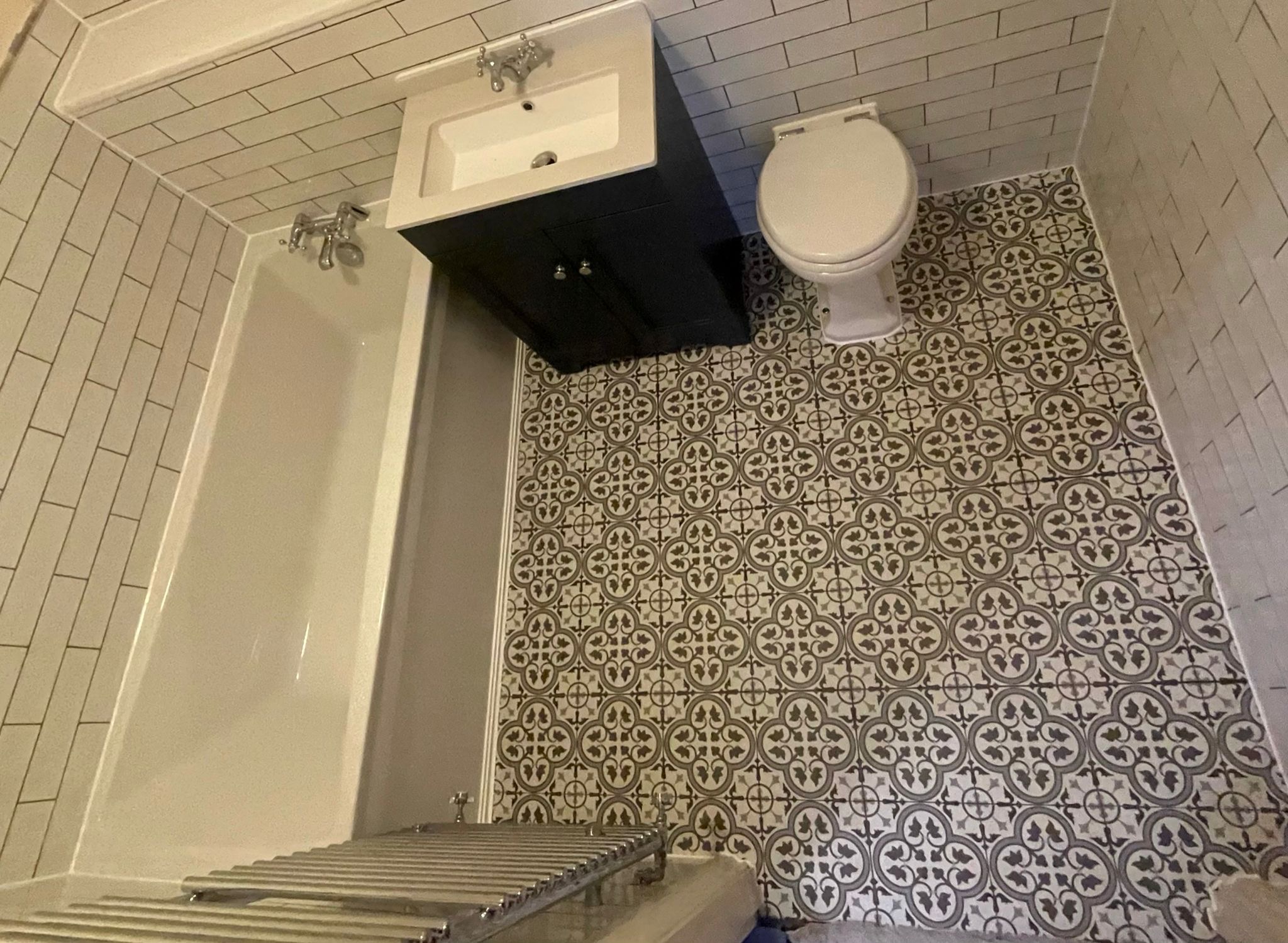 Traditional bathroom with patterned tiles